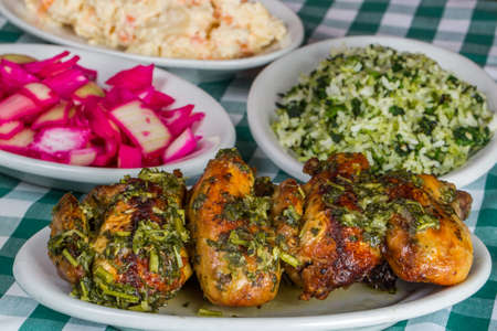 
A small chicken called galeto in Brazil served with herbs, potato salad, wine onion, rice with broccoli and potato salad.の写真素材