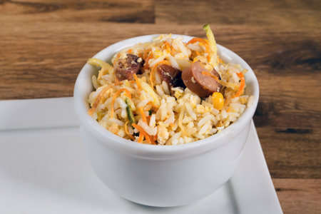 Biro-Biro rice or âcrazy riceâ. type of rice typical of Brazilian food. Rice with straw potatoes, scrambled egg and baconの写真素材