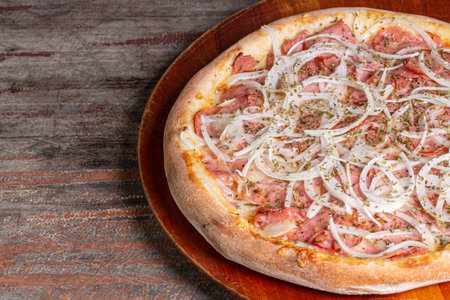 pepperoni pizza on wooden background. Brazilian pizza called pepperoni pizza.の写真素材