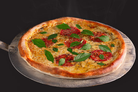 Pizza Margherita coming out of the oven. Pizza Margarita with tomato, basil and mozzarella cheese. Traditional Brazilian Pizza.の写真素材