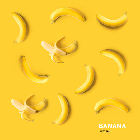 Seamless pattern with bananas. Tropical abstract background. Banana on yellow backgroundの写真素材