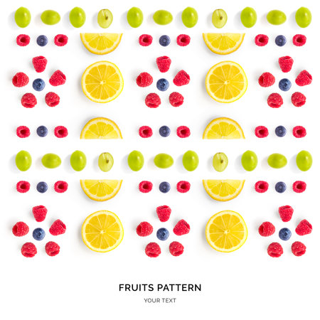 Fruits and berries pattern on white background. Flat lay, top view