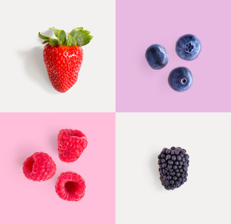 Creative layout made of fresh berries on pastel background. Flat lay, top view minimal concept.の写真素材