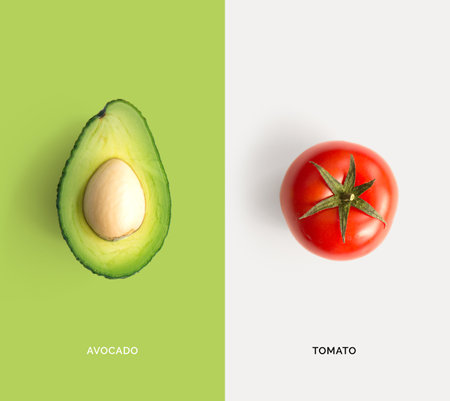 Creative layout made of avocado and tomato. Minimal food concept.の写真素材