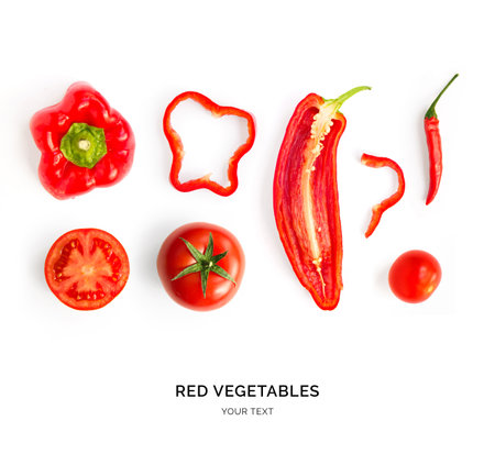 Creative layout made of red pepper, tomato and chilli pepper. Flat lay. Food concept. Red vegetables isolated on white background.の写真素材