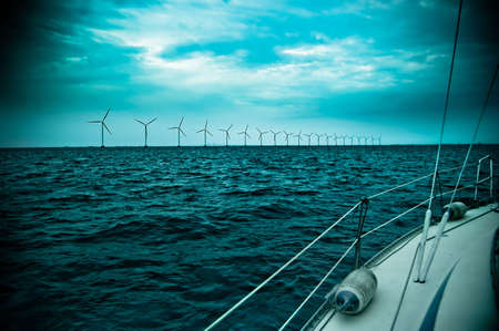 raw of windmills shot from yacht, denmark, oresund, baltic seaの写真素材