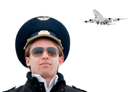 young pilot in glasses isolated with copyspace and plane on background, closeの写真素材