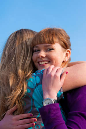 Portrait of two embracing girlsの写真素材