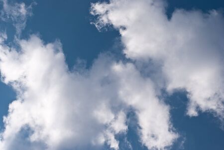 Clouds on the background of a blue skyの写真素材