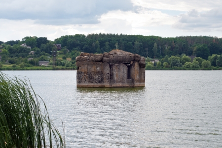 Evening lake and old pillbox near kievの写真素材