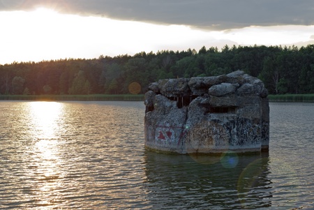 Evening lake and old pillbox near kievの写真素材