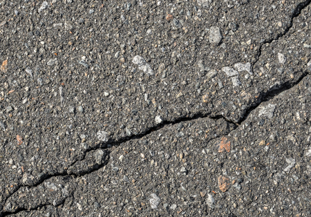 Asphalt with crack background. Old gray road for background or texture. Asphalt as abstract background or backdropの写真素材