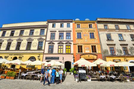 Lublin, Poland - August 10, 2017: Beautiful street and old colorful buildings in the old town of Lublin, Poland. Center of Lublin town. Old buildings and small street cafes at old Lublin town.のeditorial素材
