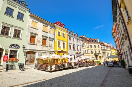 Lublin, Poland - August 10, 2017: Beautiful street and old colorful buildings in the old town of Lublin, Poland. Center of Lublin town. Old buildings and small street cafes at old Lublin town.のeditorial素材