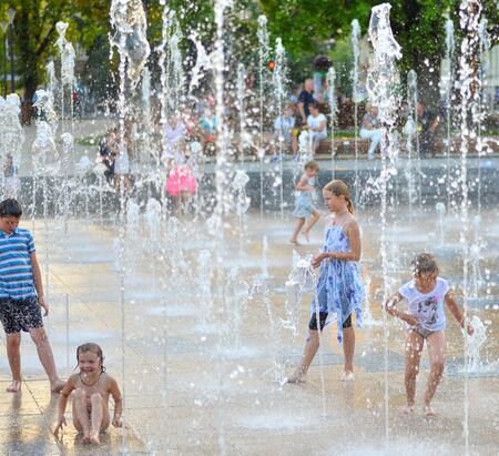 Lublin, Poland - August 11, 2017: Multimedia Lublin Fountain, Lithuanian Square, Lublin, Poland. Children playing in beautiful modern fountain in park, Lublinのeditorial素材