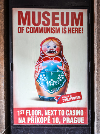 Prague, Czech Republic - October 9, 2017: Poster in the Museum of Communism in Prague, Czech Republic. Poster of very angry Matryoshka or nesting doll.のeditorial素材