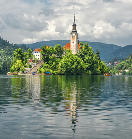 Bled, Slovenia - May 20, 2018: Beautiful Lake Bled in the Julian Alps and Assumption of Mary Church, Bled Slovenia. Mountains, Old church in the middle of the lake and dramatic sky.のeditorial素材