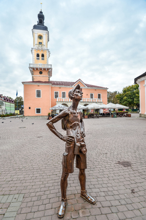 Kamianets-Podilskyi, Ukraine - October 20, 2016: Monument to the Tourist stands in front of the City Hall on the main square of Kamianets-Podilskyi, Ukraine.のeditorial素材