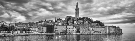 Rovinj, Croatia - May 22, 2018: Panorama of Coastal town of Rovinj, Istria, Croatia. Rovinj - beautiful antique city, yachts and Adriatic Sea. Black and white photo.のeditorial素材