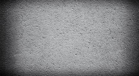 Cement or concrete wall background with darkened edges. Deep focus. Mock up or template. Dark cornersの写真素材