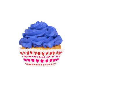 Cupcake with blue buttercream frosting isolated on white background. Copy space. Festive banner.の写真素材