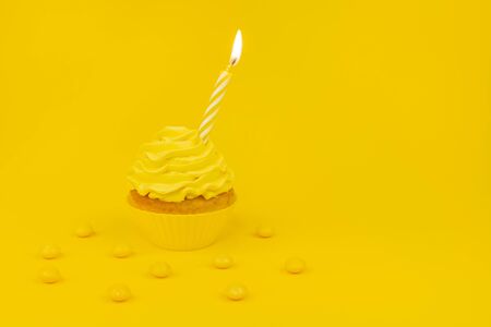 Tasty cupcake with birning candle on a yellow background. Monochrome birthday concept banner with...