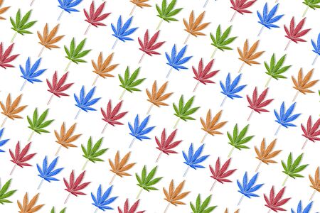 Colorful leaves of hemp or cannabis diagonal pattern on blue background. Fall backgroundの写真素材