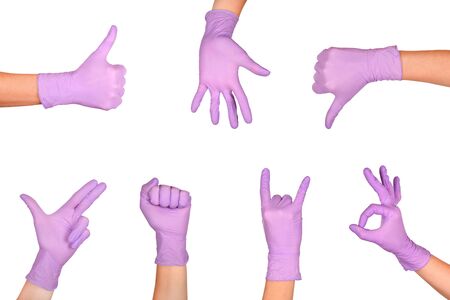 Set of Hand gestures in lilac disposable latex surgical gloves isolated on white background. Hand sign set.の写真素材