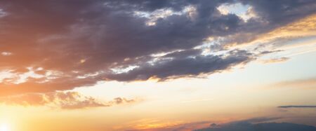 Evening sky with sun flare. Long poster or banner. Gorgeous Panorama twilight or morning sky and cloudsの写真素材