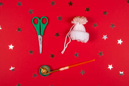Step by step instruction for New Year or Christmas DIY concept. Make a cute hat for Christmas tree decoration. Step 8の写真素材