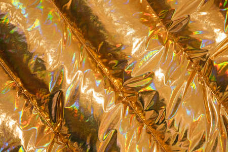 Golden fabric background or texture close up. Abstract golden background with diagonal stripes.の写真素材