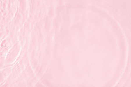Surface of pink swimming pool. Texture of transparent blue water in swimming pool. Trendy abstract...