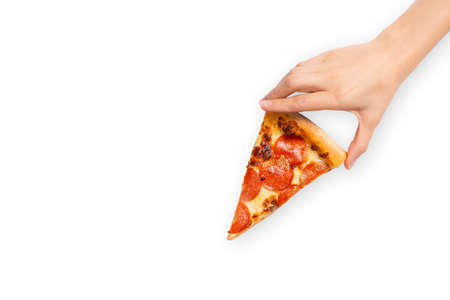 Slice of pepperoni pizza in hand isolated on white. Top view on paperoni pizza. Concept for italian...
