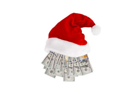 New year or Christmas gift concept. Money inside Santa hat. Christmas hat full of 100 dollar bill isolated on whiteの写真素材
