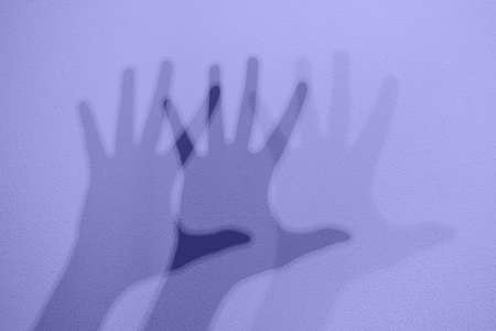 Monochrome shadows of a hand dancing to the music. Interactive exposition in science museum. Banner...