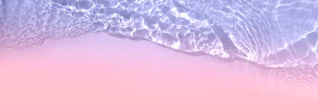 Serum or water texture close up. Light purple and pink gradient water background. Transparent beauty skincare sample. Cosmetic clear liquid smudge. Long banner with copy spaceの写真素材