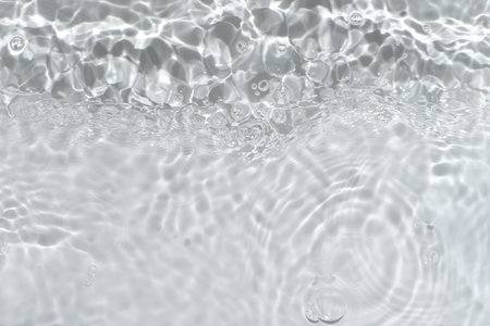 Transparent clear calm water surface texture with waves, splashes and bubbles. Trendy abstract...