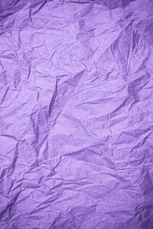 Top view of wrinkled textured paper. Purple crumpled paper texture background. Wrinkled, abstract paper background. Vertical banner.の写真素材