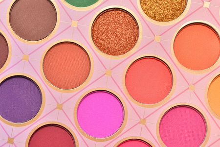 Close up view on bright colors make up palette set. Professional multicolor eyeshadow palette. Professional multicolor eye shadow make-up palette background.の写真素材