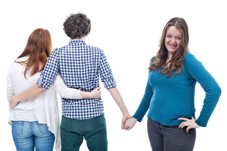 Love triangle of two teen girls and one young boyの写真素材