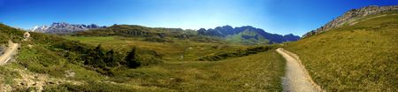 Hiking path in swiss mountains. Panorama view.の写真素材
