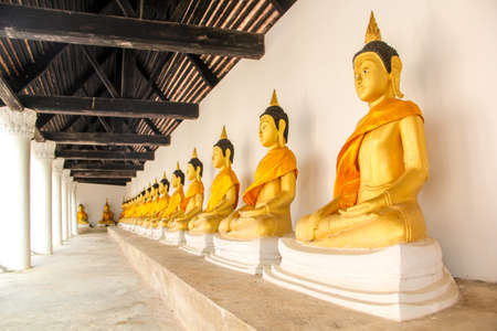 Many golden Buddha statues at Wat Wang Temple, historical significance for Phatthalung, Thailand.のeditorial素材