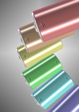 A group of different colored batteries suspended in the airの写真素材