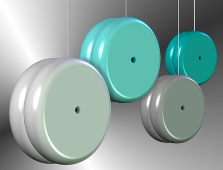 Blue and white yo yos suspended in the airの写真素材