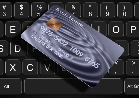 A black keyboard and a credit card on top of itの写真素材
