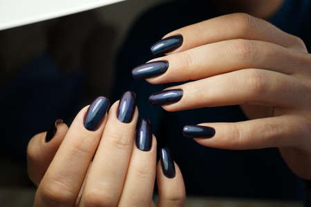 Awesome nails and beautiful clean manicure. Nails are natural. Manicure is made using nails drill machine.の写真素材