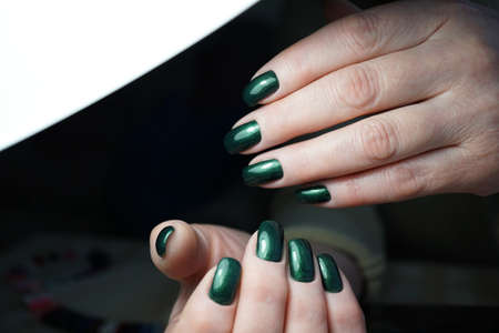 Awesome nails and beautiful clean manicure. Nails are natural. Manicure is made using nails drill machine.の写真素材