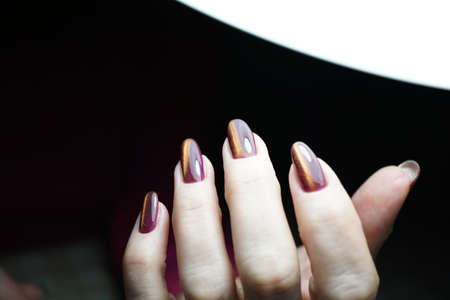 Awesome nails and beautiful clean manicure. Nails are natural. Manicure is made using nails drill machine.の写真素材