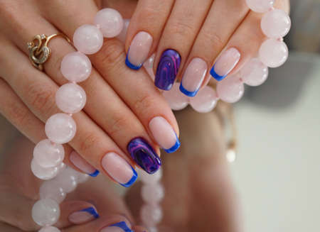 Awesome nails and beautiful clean manicure. Nails are natural. Manicure is made using nails drill machine.の写真素材