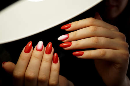 Awesome nails and beautiful clean manicure. Nails are natural. Manicure is made using nails drill machine.の写真素材